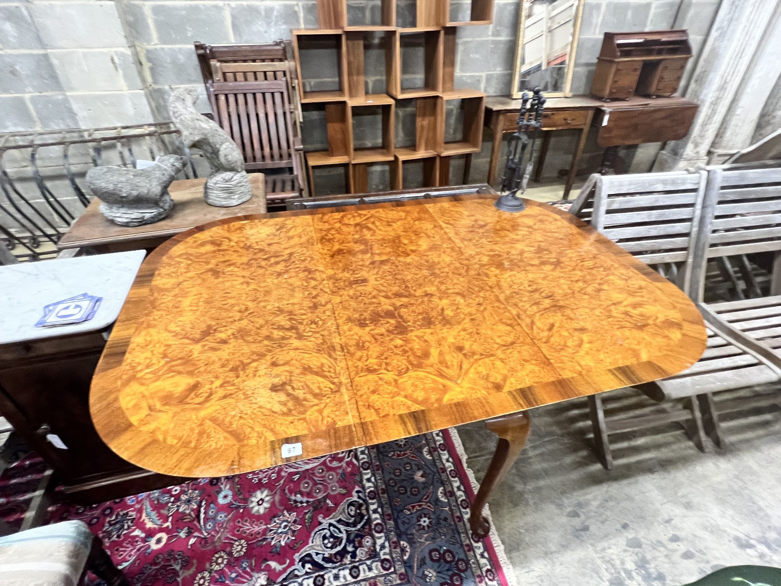 A Queen Anne Walnut revival burr walnut pad foot drop leaf dining table, extended 144cm width 99cm height 74cm
